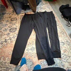 2 women’s black healing hand joggers